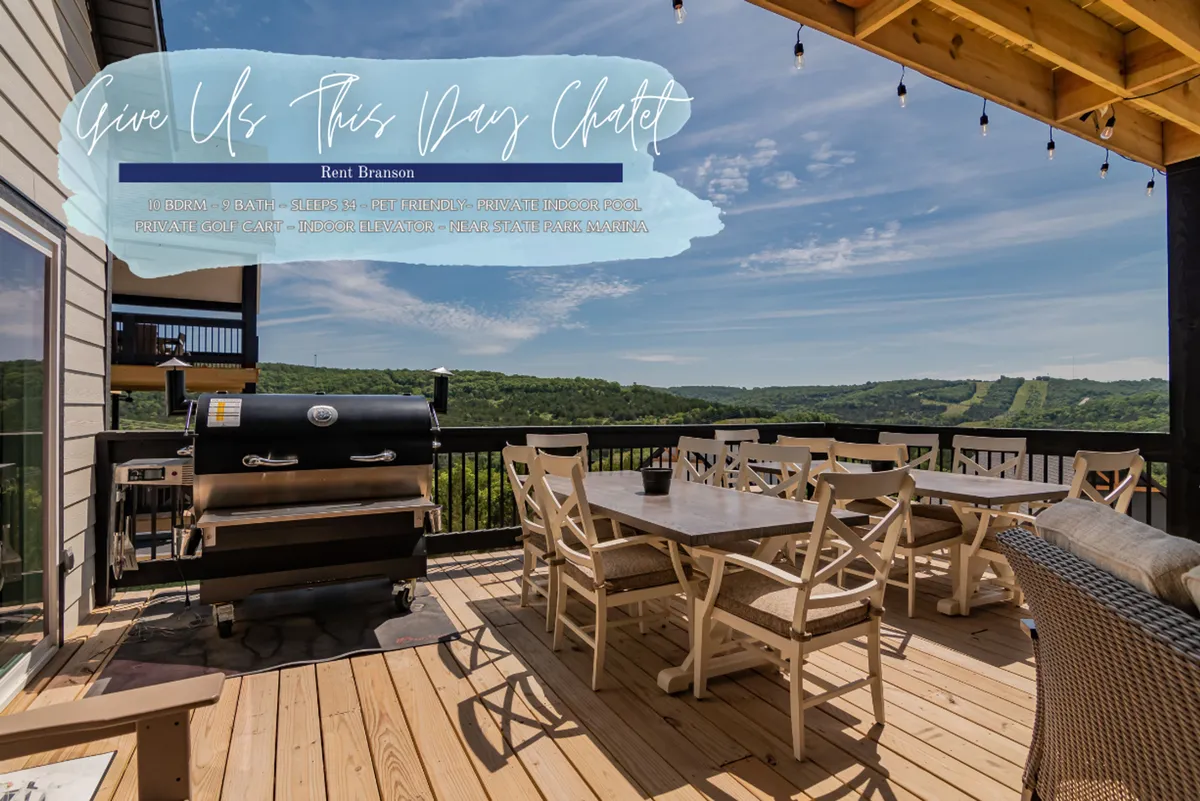 An outdoor deck with a grill, dining table, and a sweeping view of hills—an idyllic spot for alfresco dining, grilling, and sunset toasts. String lights create a festive, relaxed ambiance that invites group gatherings and celebrations.